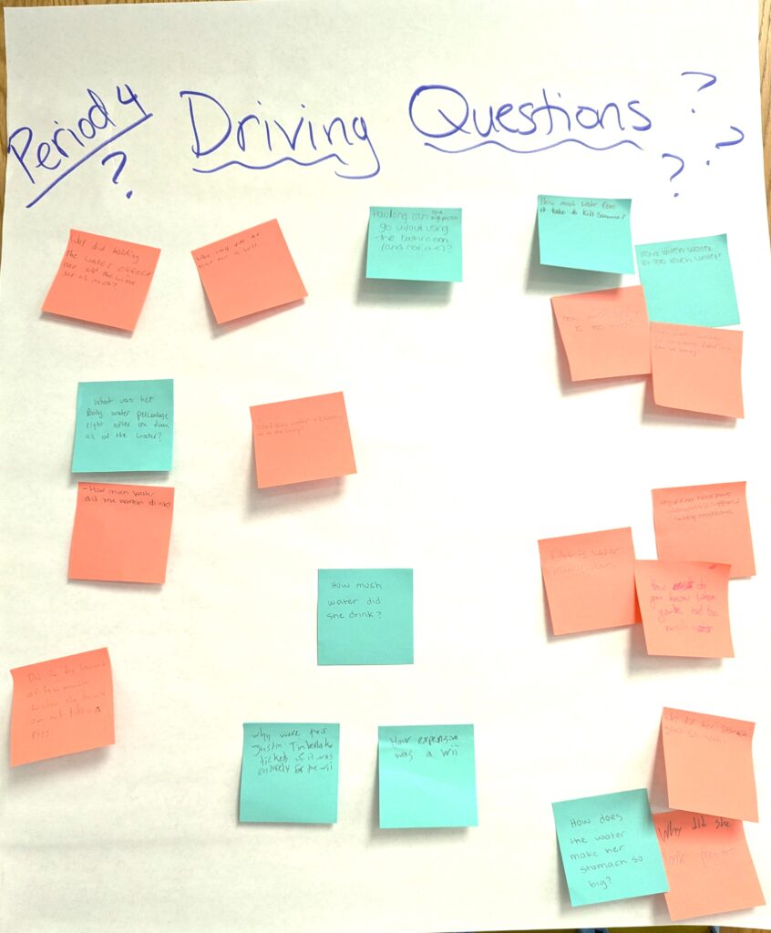 A paper-based driving question board with multiple sticky notes and a heading that says: Period 4 Driving Questions